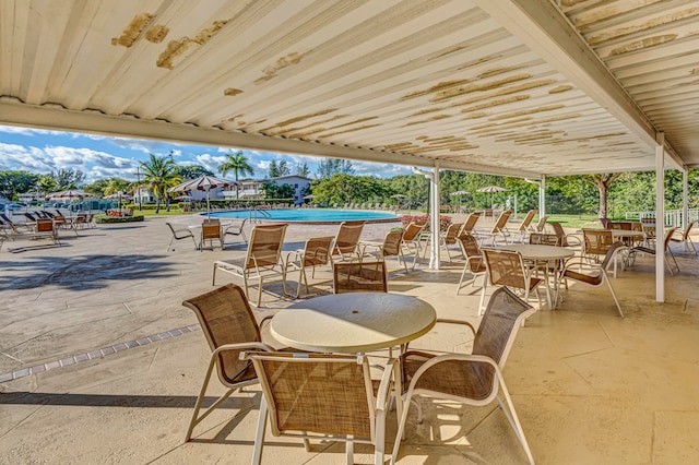 view of patio with a community pool