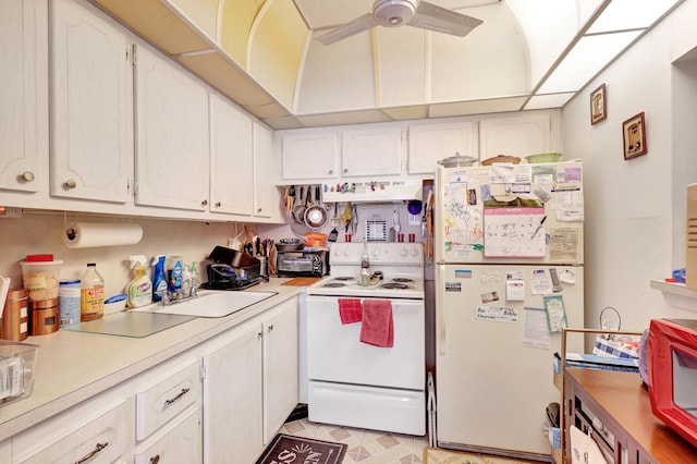 kitchen featuring ceiling fan, light tile flooring, white appliances, white cabinets, and ventilation hood