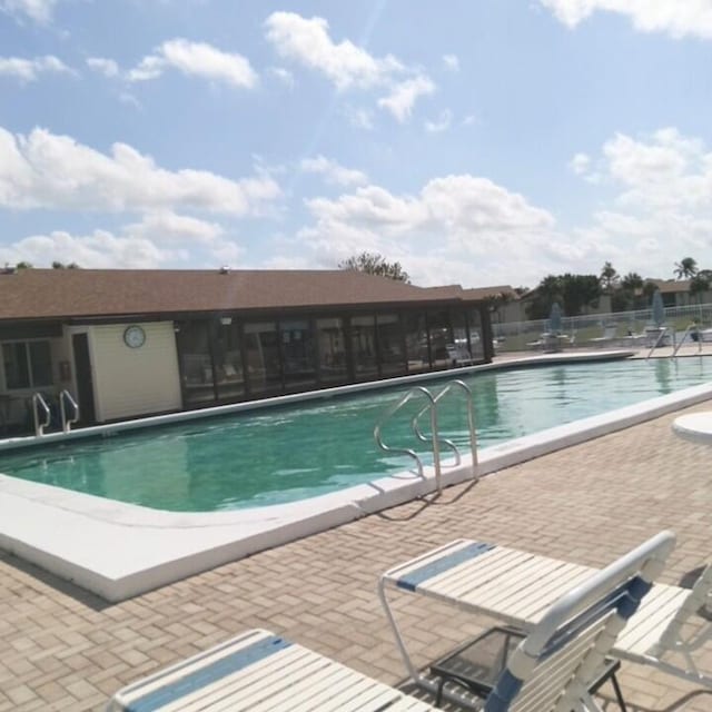 view of swimming pool with a patio