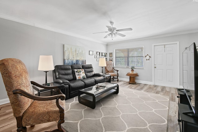 living room featuring crown molding, ceiling fan, and light hardwood / wood-style flooring