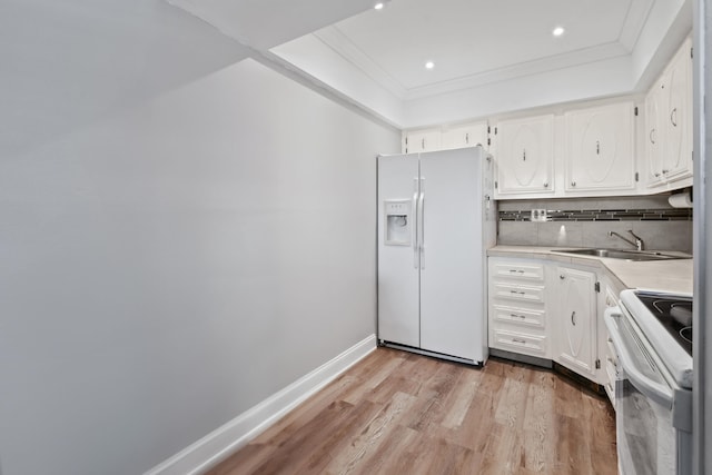 kitchen featuring white cabinetry, white appliances, light wood-type flooring, and sink