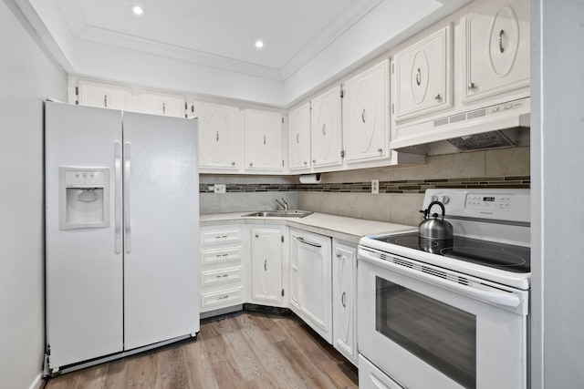 kitchen with tasteful backsplash, light hardwood / wood-style floors, white appliances, and white cabinetry