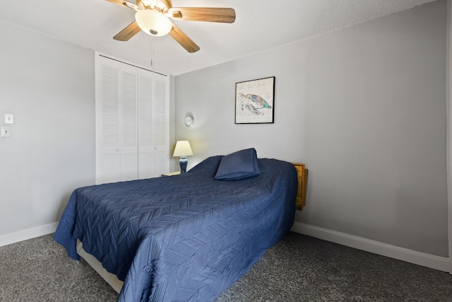 carpeted bedroom with a closet and ceiling fan