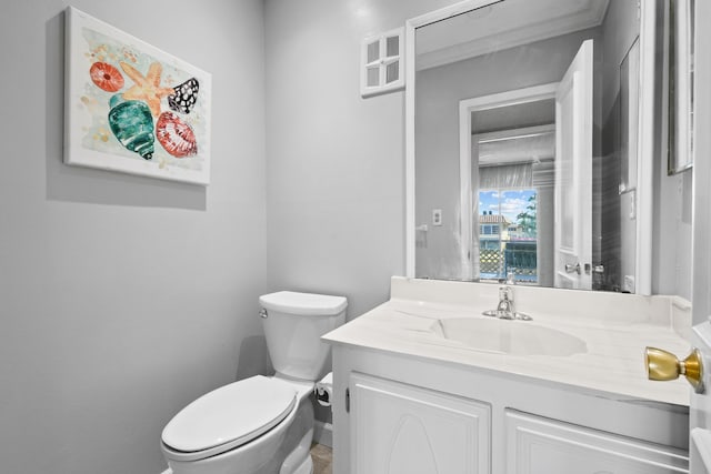 bathroom featuring vanity and toilet