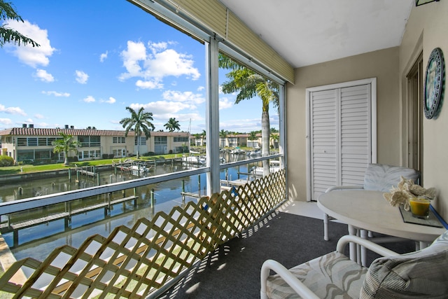 balcony featuring a water view