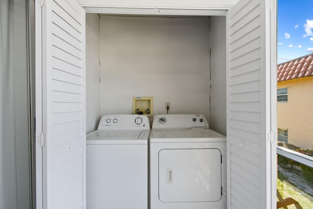 laundry room featuring washer hookup and washer and dryer