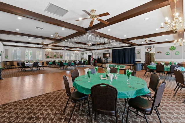 dining room with ceiling fan with notable chandelier and beamed ceiling