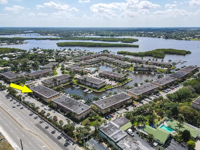 birds eye view of property featuring a water view