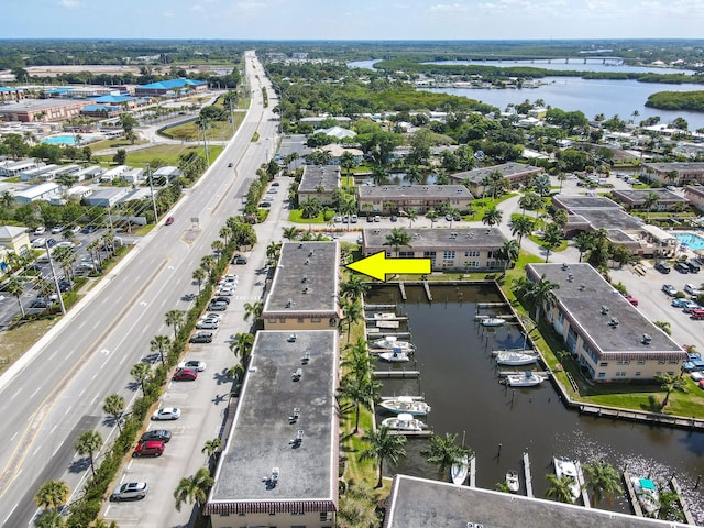 birds eye view of property with a water view