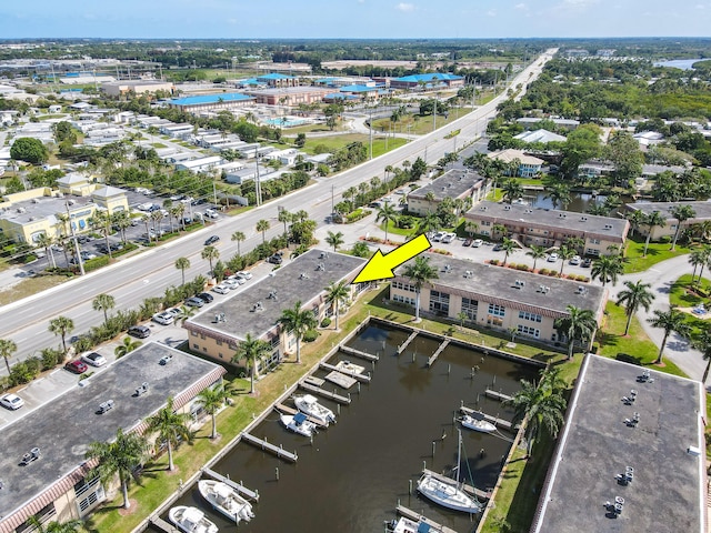 birds eye view of property featuring a water view