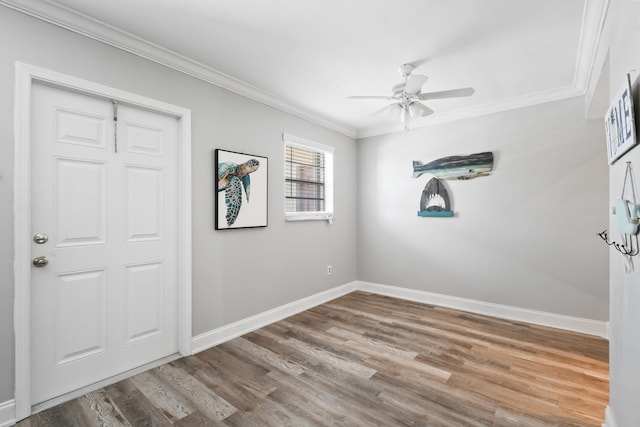 spare room with hardwood / wood-style floors, ceiling fan, and ornamental molding