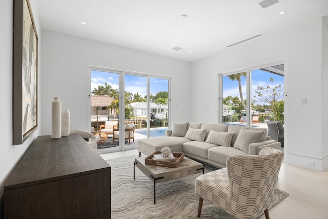 living room with light hardwood / wood-style flooring