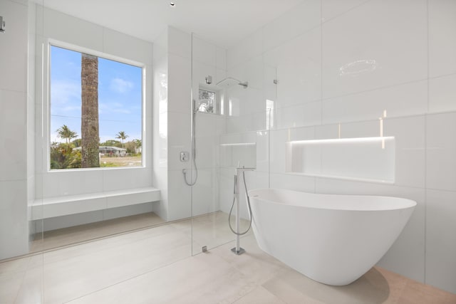 bathroom with tile walls and tile floors