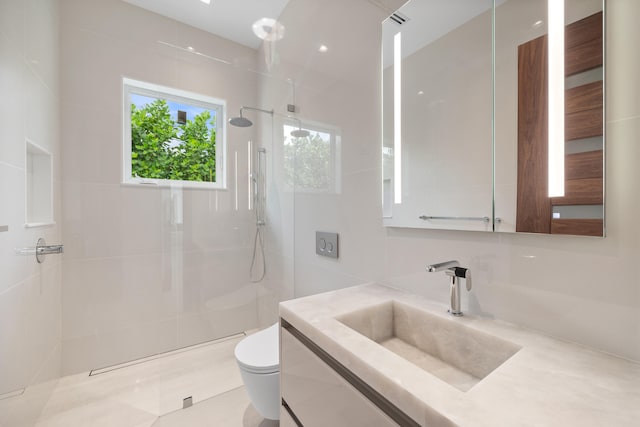 bathroom featuring vanity, walk in shower, and toilet