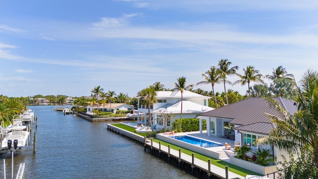 view of dock featuring a water view, a patio area, and a gazebo