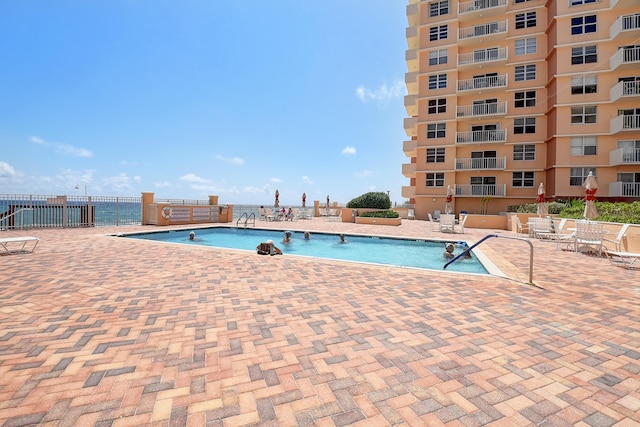 view of swimming pool with a patio