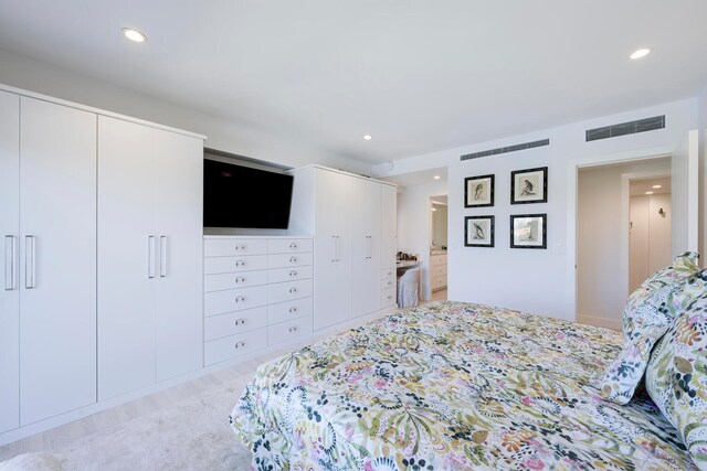 bedroom featuring light colored carpet