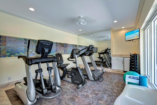 workout area with ornamental molding, ceiling fan, and tile flooring