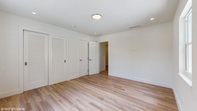 unfurnished bedroom with light hardwood / wood-style flooring