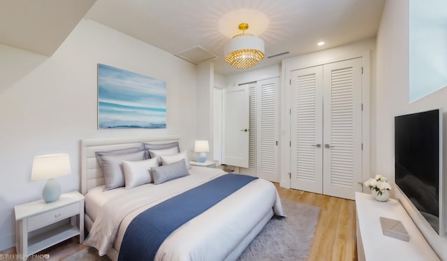 bedroom with light hardwood / wood-style flooring