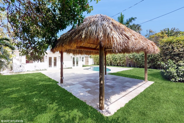 view of patio featuring a gazebo, french doors, and a fenced in pool