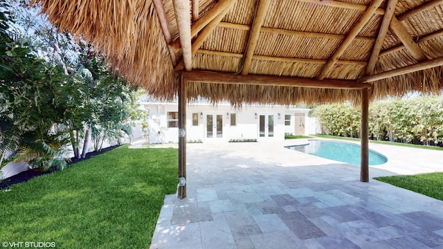 view of pool featuring a gazebo, a patio area, french doors, and a lawn