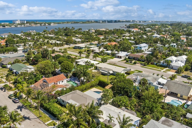 birds eye view of property with a water view