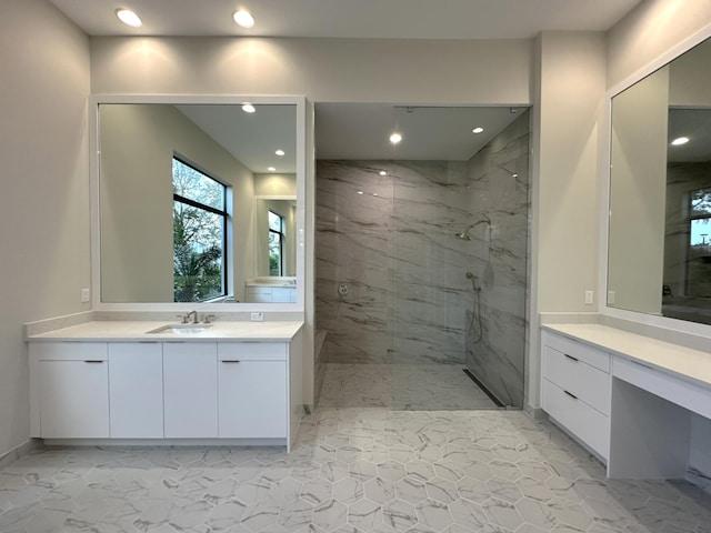 bathroom featuring vanity and a tile shower