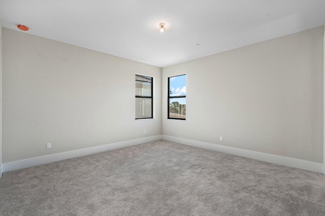 empty room with carpet flooring