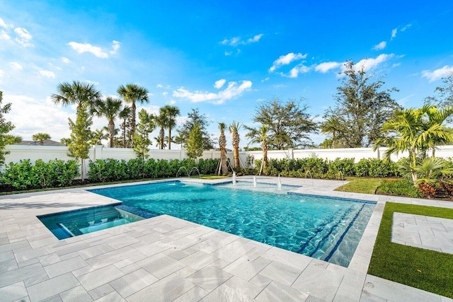 view of pool with an in ground hot tub