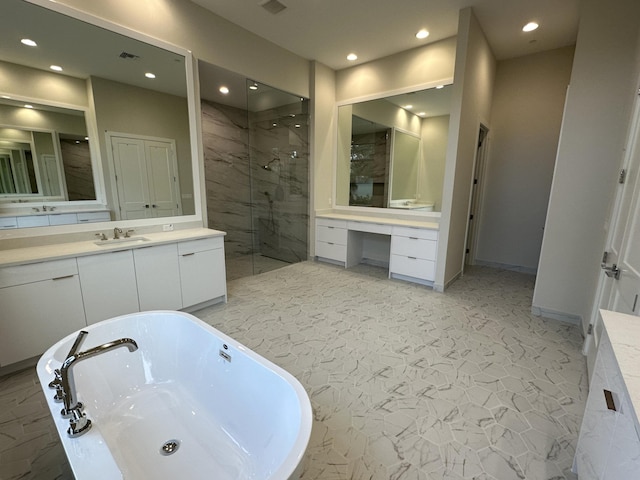 bathroom featuring vanity and separate shower and tub