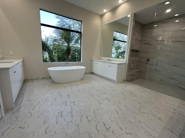 bathroom featuring plus walk in shower and vanity