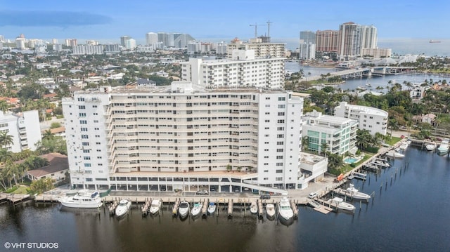 birds eye view of property with a water view