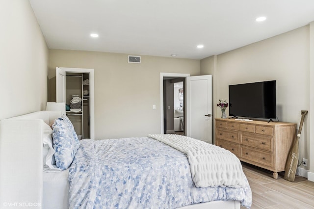 bedroom with a closet and light hardwood / wood-style flooring