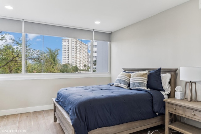 bedroom with light hardwood / wood-style floors