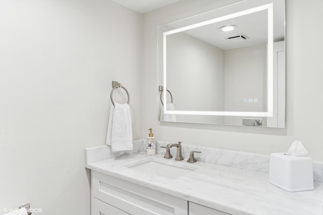 bathroom with vanity with extensive cabinet space