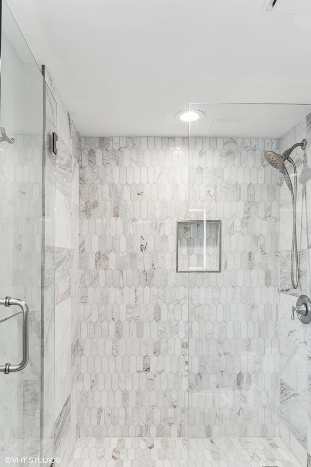 bathroom with an enclosed shower