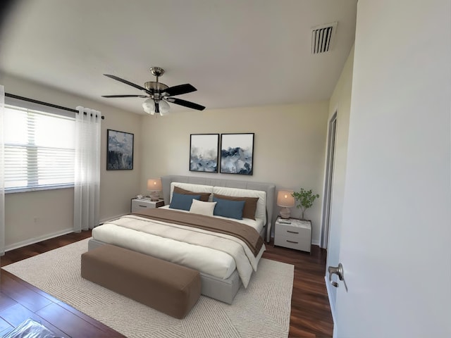 bedroom with dark wood-type flooring and ceiling fan