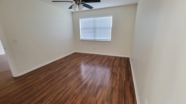 spare room featuring hardwood / wood-style flooring and ceiling fan