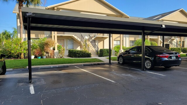 view of vehicle parking with a carport