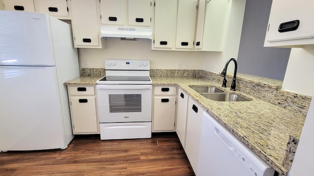 kitchen with white appliances, light stone countertops, dark hardwood / wood-style flooring, custom range hood, and sink