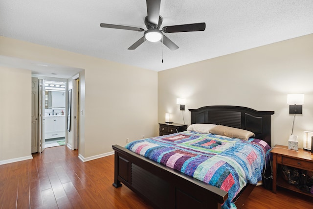 bedroom with ensuite bathroom, ceiling fan, a textured ceiling, and dark hardwood / wood-style flooring