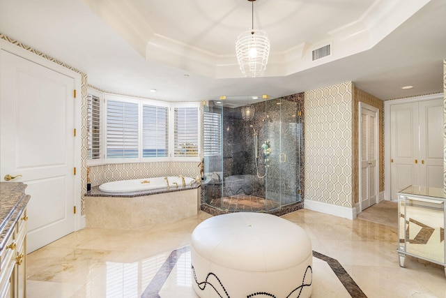 bathroom with ornamental molding, vanity, a raised ceiling, a notable chandelier, and plus walk in shower