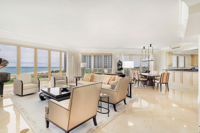 living room with a healthy amount of sunlight, a water view, and ornamental molding