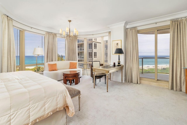 bedroom with a water view and multiple windows