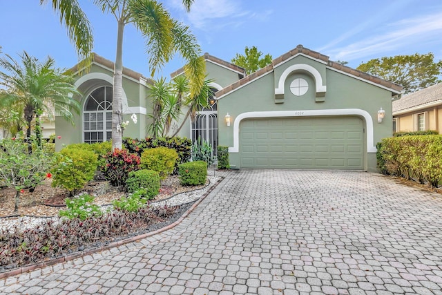 mediterranean / spanish house featuring a garage