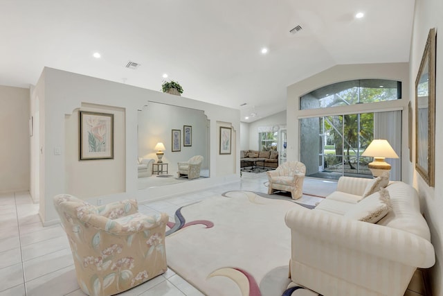 tiled living room with vaulted ceiling