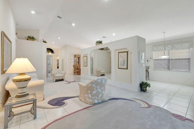 living room with light tile patterned floors and lofted ceiling