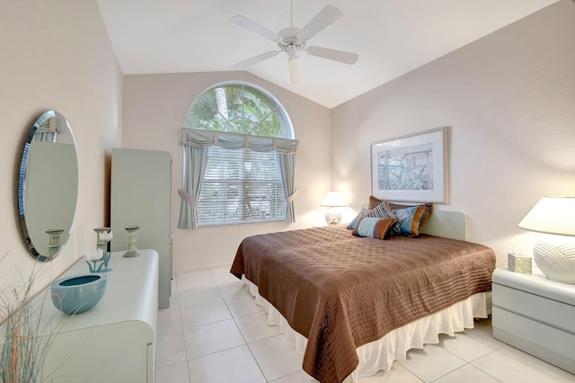 bedroom with lofted ceiling, light tile patterned floors, and ceiling fan