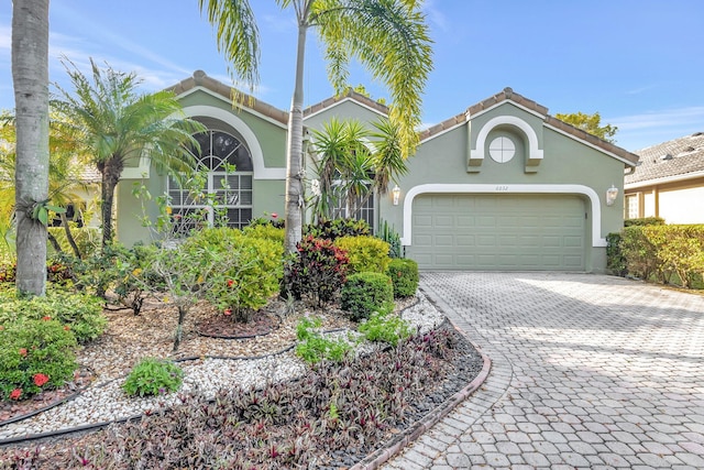 mediterranean / spanish-style house featuring a garage